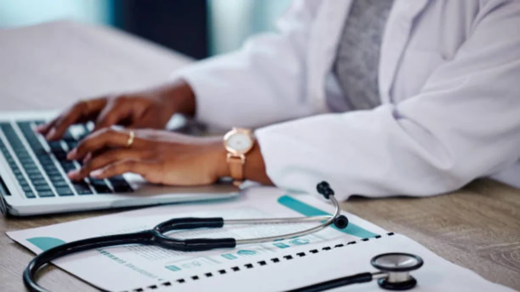 Medical biller reviewing October 2026 chiropractic billing policy changes