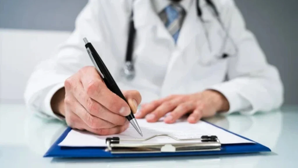 Chiropractor documenting CPT modality billing on a patient chart