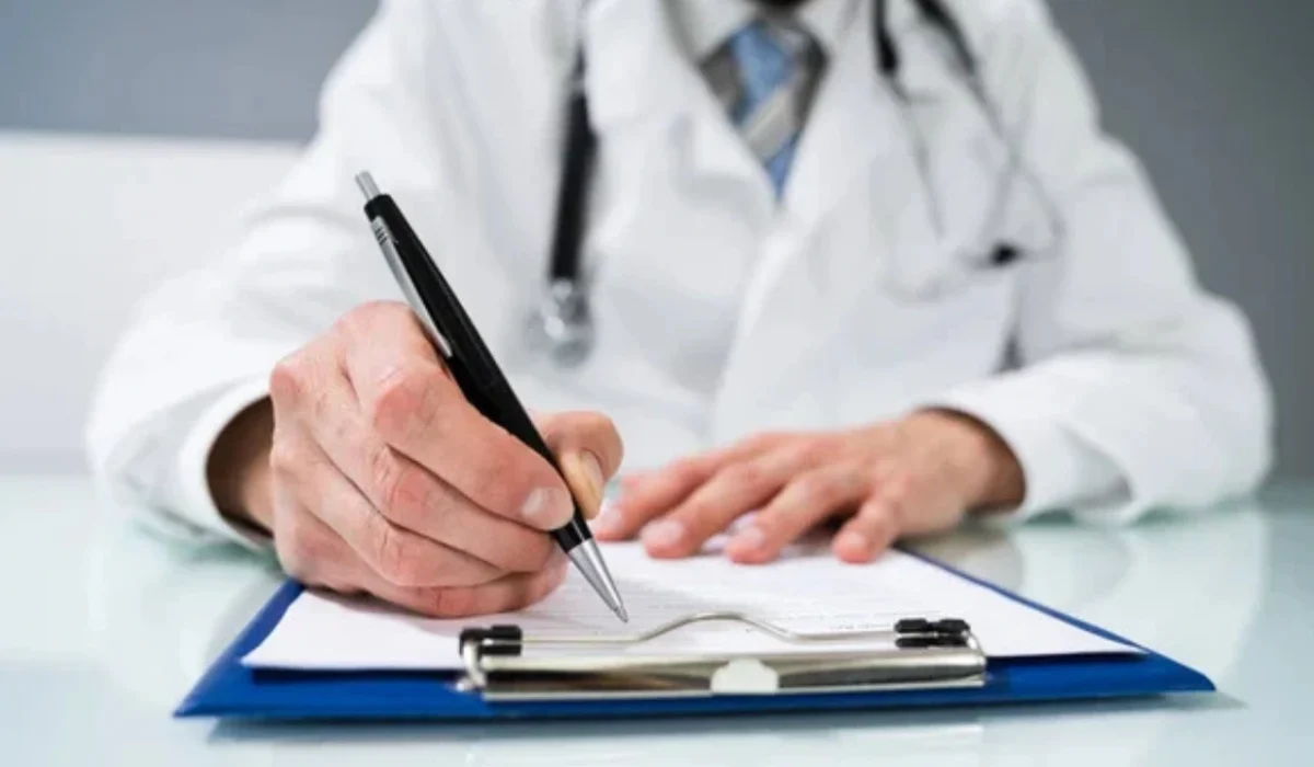 Chiropractor documenting CPT modality billing on a patient chart